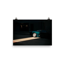 Load image into Gallery viewer, Parked Jaguar XJ220 lit by a slice of sunlight