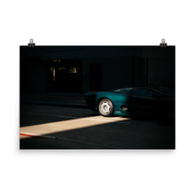 Load image into Gallery viewer, Parked Jaguar XJ220 lit by a slice of sunlight