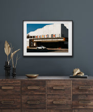 Load image into Gallery viewer, Framed image on gray wall of Martini Porsche 911 in front of Martini theater