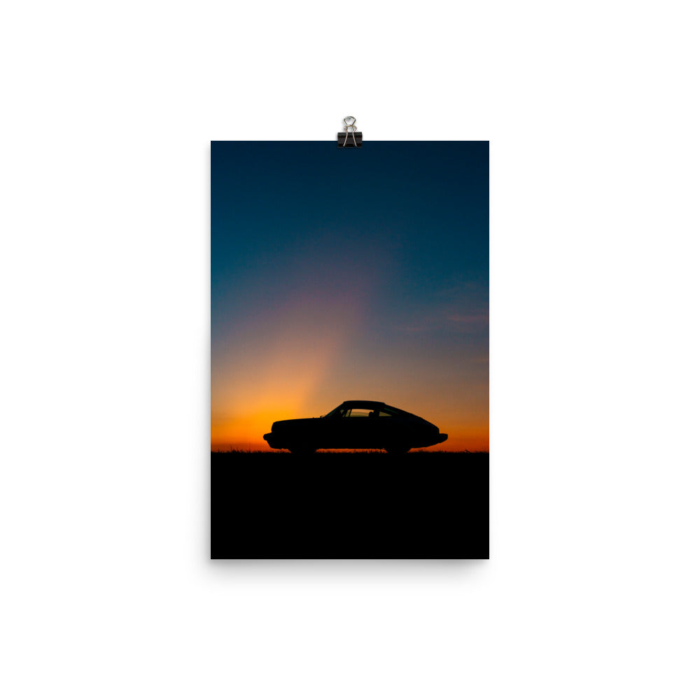 Vintage Porsche 911 side profile silhouette at sunset